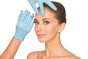 Woman receives Botox between her brows for lasting rejuvenation.